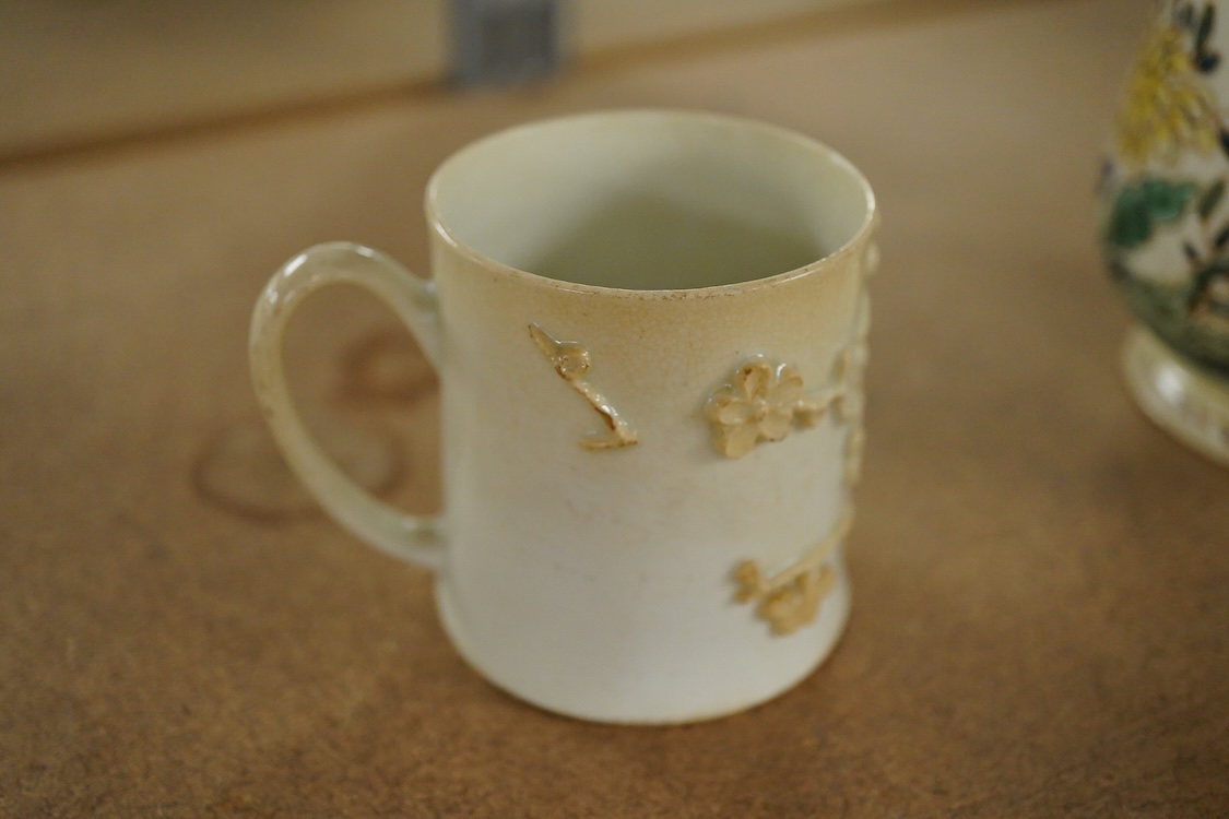 A Bow polychrome mug - 11.5cm high and a Bow prunus sprigged coffee can, c.1760-70